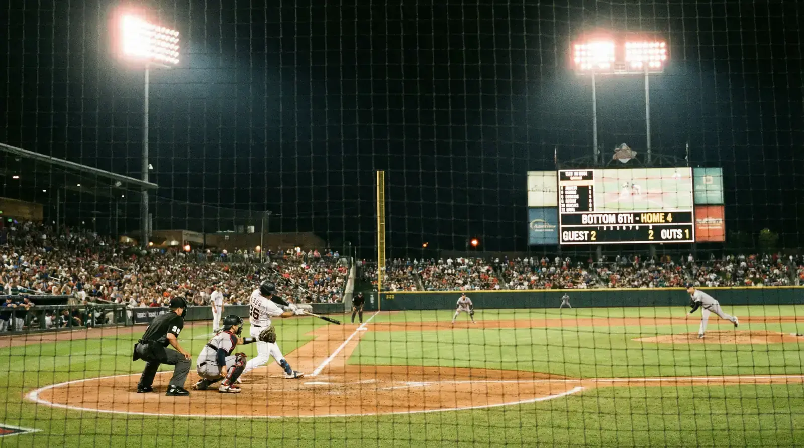 Baseball game in progress during the fifth inning with the scoreboard showing the mid-game score